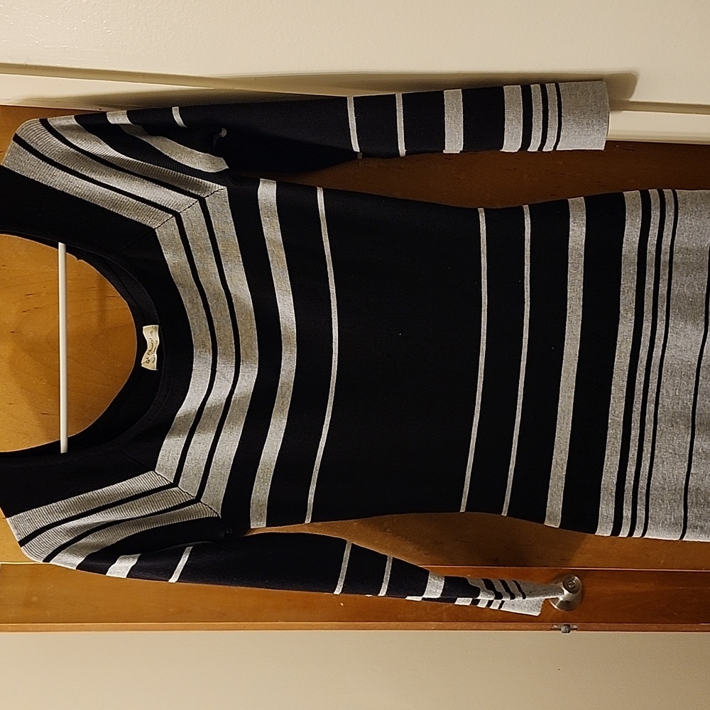 A black and grey striped knit dress